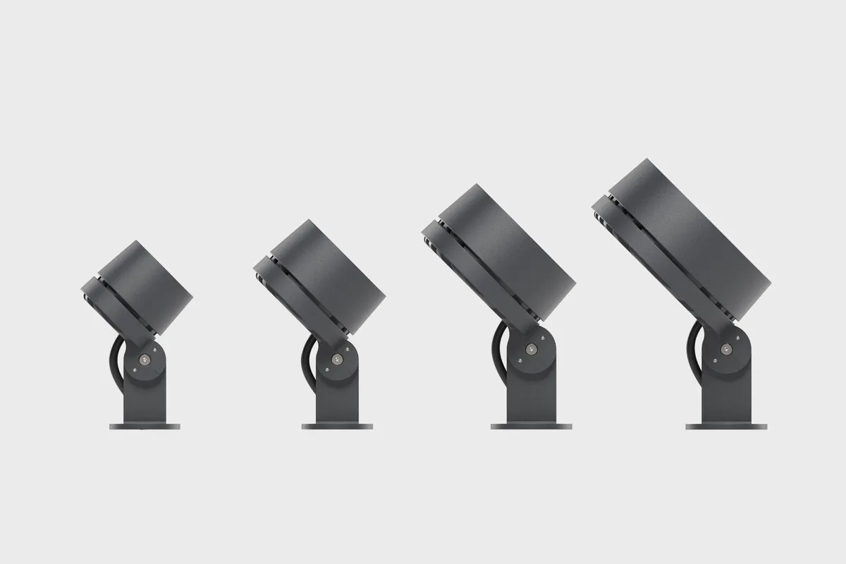 Four Chameleon heads in dark grey against a plain ground, each tilted further than the last, showing the range the head swings through on its bracket.