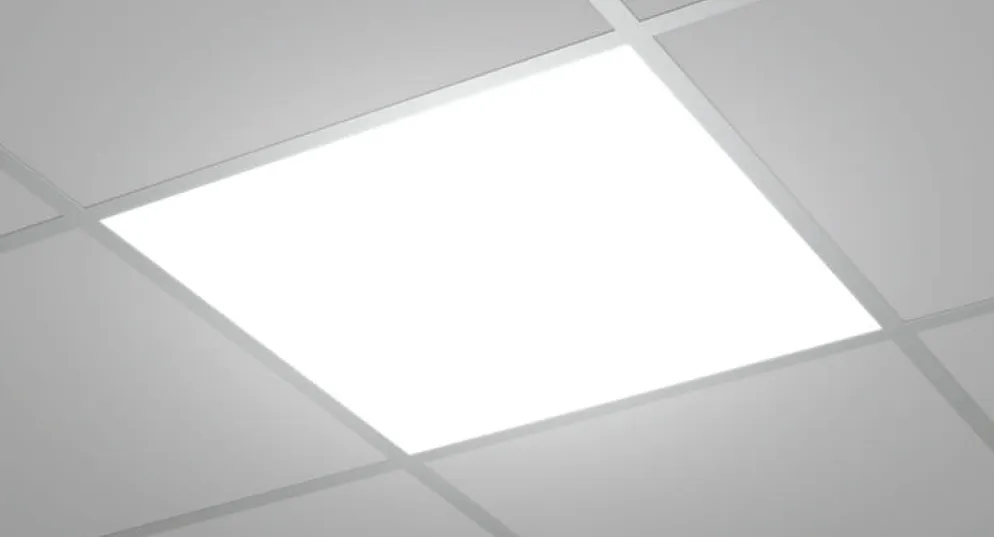 A recessed panel lit in a suspended tile ceiling, its diffuser an even sheet of white light.